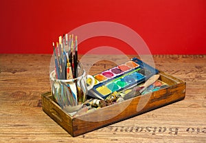Artist studio painting art supplies brushes and colors photo