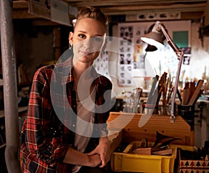 Artist, studio and portrait of woman in workshop for creative sculpture or project at night. Artisan, workplace or