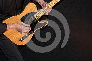 Artist with a Telecaster natural electric guitar