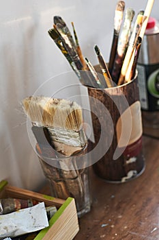 Artist tools in studio. Creating modern artwork on canvas.