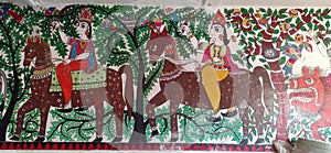 Artist trying to express the people horse riding through forest with the help of mithila art in madhubani India