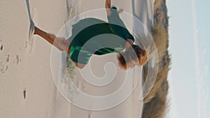 Artist woman dancing sand desert at summer day vertical. Girl performing dance