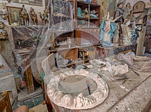 Artist work table with artwork and tools