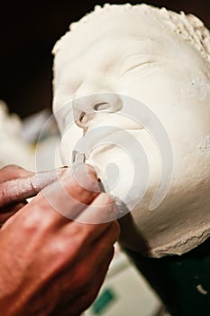 Artist working on a clay model