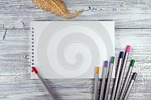 Artist workspace. Drawing tools, stationary supplies, workplace of artist. blank paper on white wooden desk, top view, flat lay, c