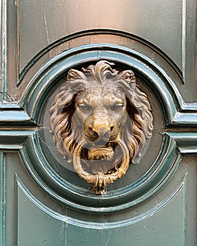 An Artistic and antique door knocker.