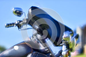 Artistic blur. The front of the black motorcycle Harley Davidson at the festival Meeting of summer Russia, Kursk region,