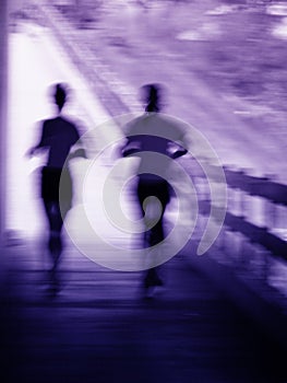 Artistic blur of a running couple