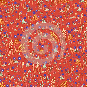 Artistic colorful field wild flowers seamless floral pattern. Decorative flowers and plants on a orange background. Original