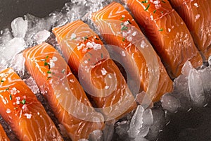 Artistic culinary concept Portioned salmon fillets showcased on ice