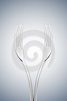 Artistic cup of wine form or hands form made with two forks.