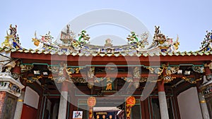 Richly decorated roof of a buddhist Taiwanese temple, Tainan, Taiwan photo