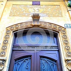 Artistic door, urban design, architecture and Liberty style in Turin city, Italy