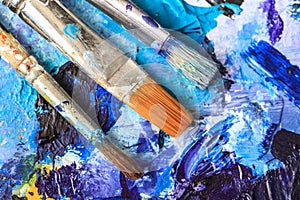 Artistic equipment. Brushes and paints for drawing. Items for children`s creativity.