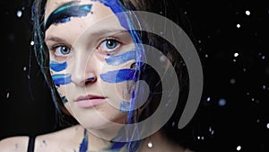 Artistic face paint woman blue warrior makeup