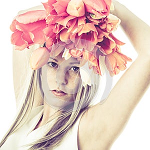 Artistic image of young woman holding flowers