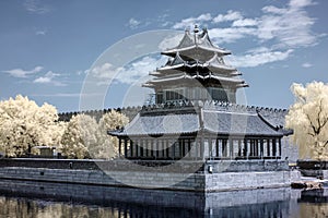 Artistic infrared shot of the Northwest corner tower of Forbidden City and Tongzi River in Beijing