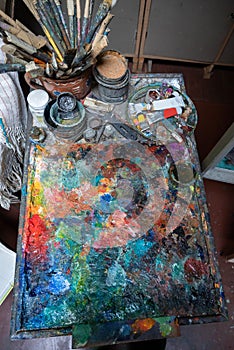 Artistic paints, tools, brushes and palette