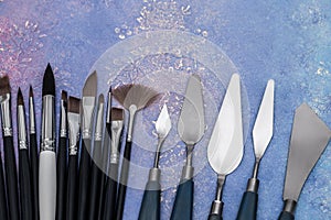 Artistic palette knives and drawing brushes, creative tools of various sizes and shapes