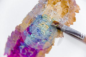 Artistic palette with paint brushes and oil paint