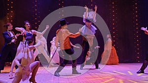 Artistic people dancing on stage in theatre