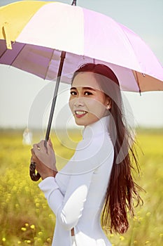 Artistic portrait: a girl in a flower field in Hoang Dau An, Viet Nam