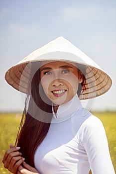 Artistic portrait: a girl in a flower field in Hoang Dau An, Viet Nam