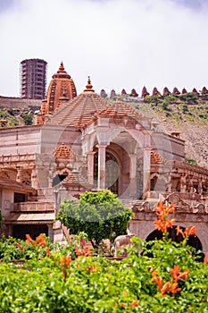 artistic red stone jain temple at morning from unique angle