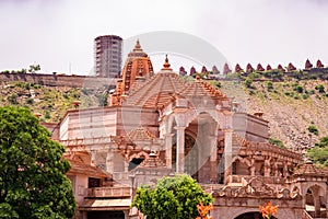 artistic red stone jain temple at morning from unique angle