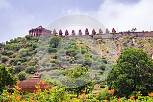 artistic series or red stone jain temple at mountain top at morning from unique angle