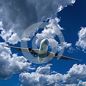 Airliner in flight with Cumulus cloud in blue sky. Australia.