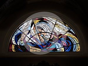 artistic stained glass window in the sanctuary of Fatima, a famous place of worship in Portugal