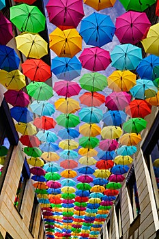 Artistic street decorated with colored umbrellas