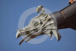 An artistic waterspout that looks like a dragon\'s head.