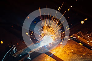 Artistic welding sparks light, industrial background