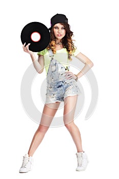 Artistic Woman in Jeans showing Retro Vinyl Record
