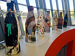 Artistically designed Coca-Cola bottles.