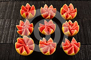 Artistically sliced red guava fruits,