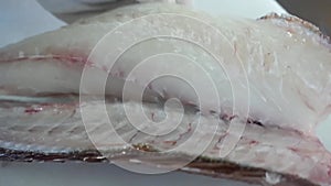 Artistry of the Blade - Masterful Sea Bass Fillet Preparation for Gourmet Delight