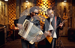 Artists with accordion and balalaika, rock band