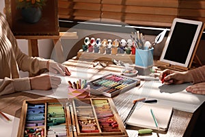 Artists drawing with soft pastels at table, closeup