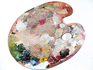 Artists palette with colors mix over white background.