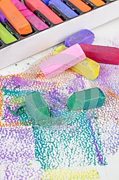 Artists soft pastel chalk crayons on an art pad