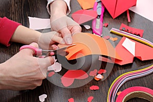 Arts and craft supplies for Saint Valentine`s. Color paper, different washi tapes, hearts supplies for decoration.