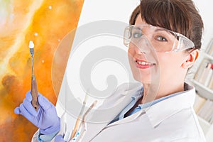 Artwork conservator at work