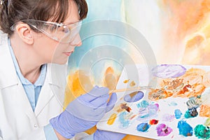 Artwork conservator at work