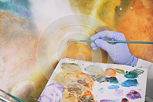 Artwork conservator at work