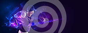 Artwork, poster or flyer. One professional baseball player in motion and action with bat isolated on dark background