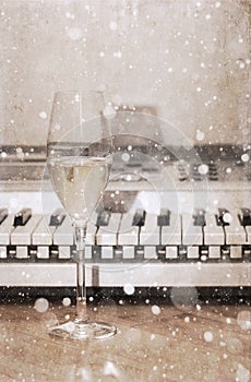 Artwork in vintage style, champagne glass, pianoforte