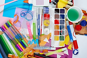 Artwork workplace with creative accessories, art tools for painting and drawing